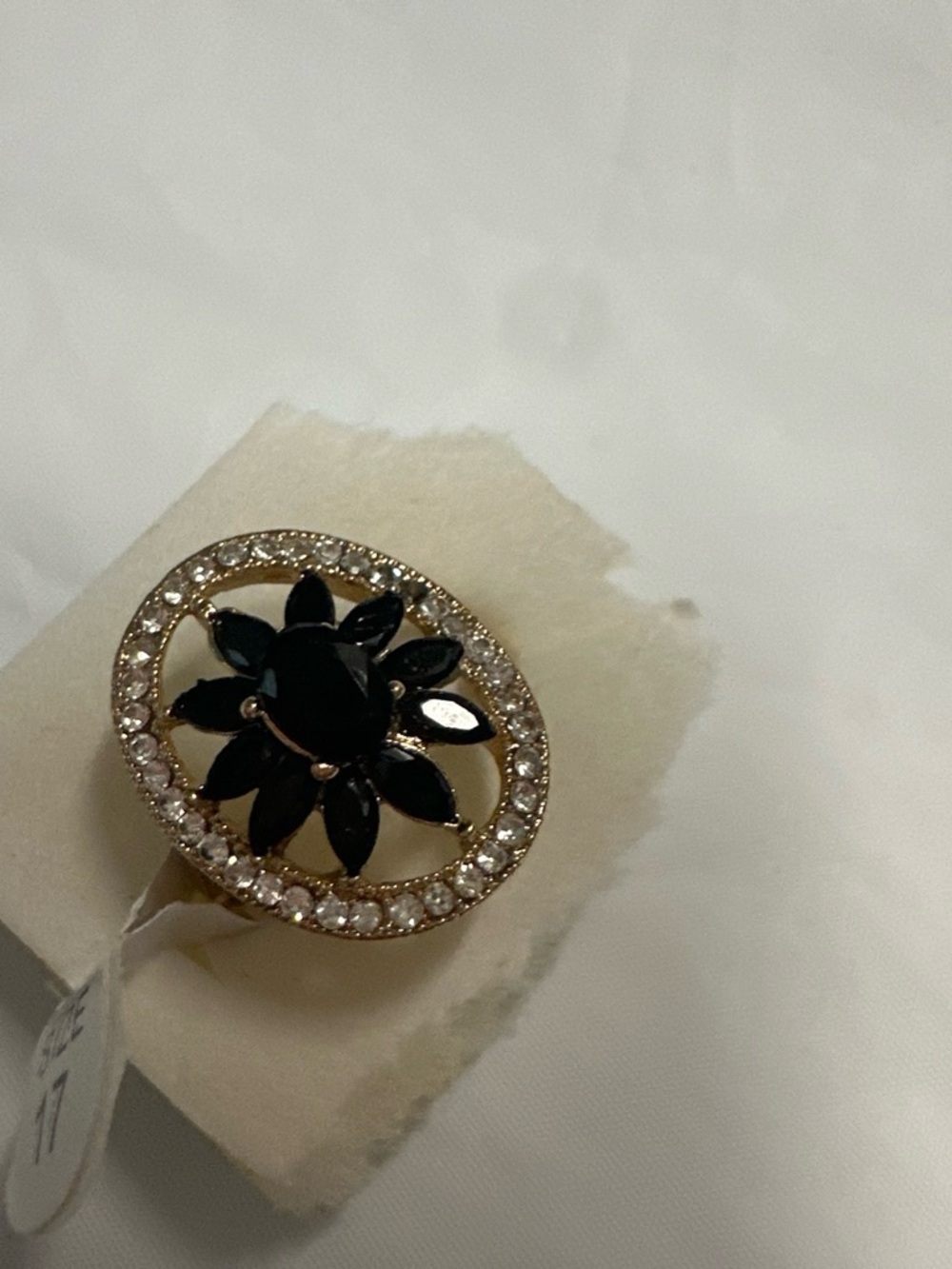 Gold-Tone Ring with Black Floral Center and Clear Accents size 17